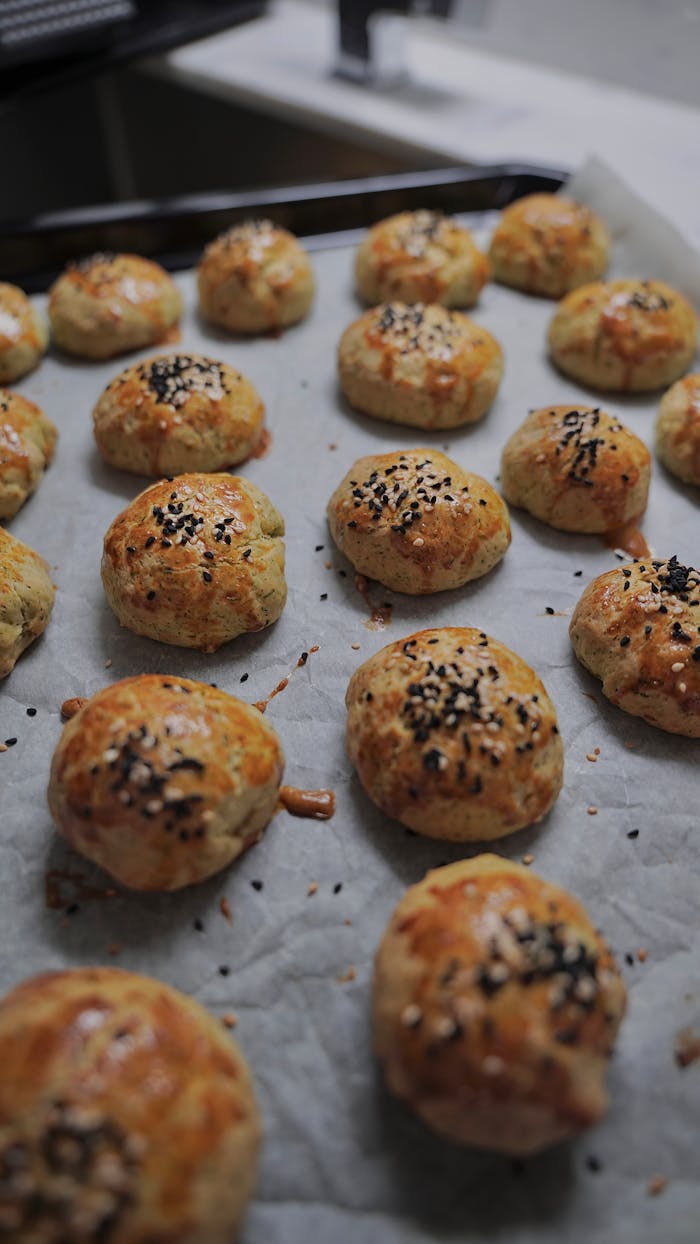 The Art of Drawing Readers In: Your attractive post title goes here Golden pastry buns topped with sesame seeds fresh out of the oven.